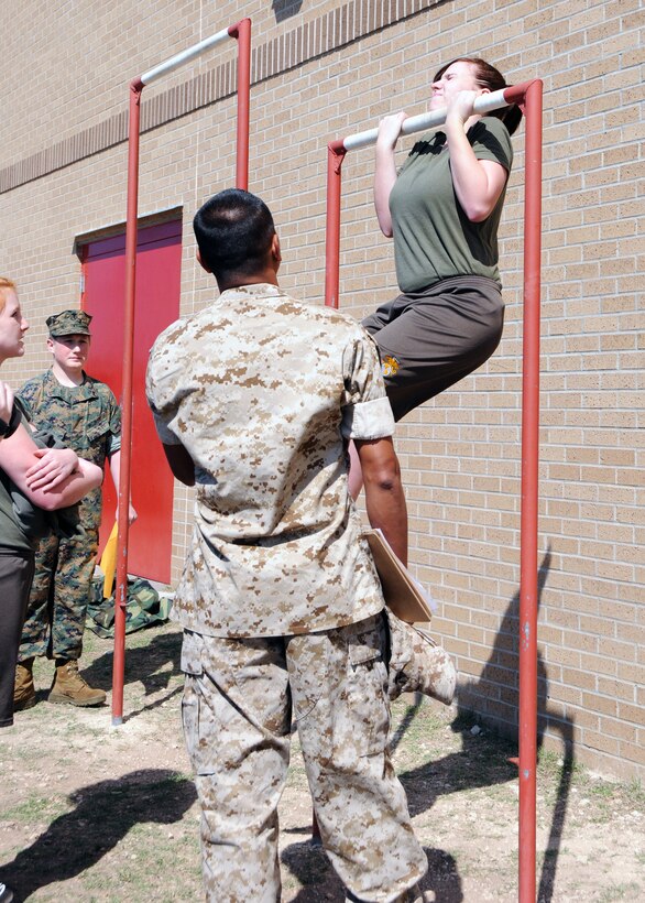 Cadet Lance Cpl. Sabrina Peterson, a Marine Corps Junior Reserve Officer Training Corps cadet from Round Rock High School, performs a flex-arm hang for the Physical Training event at an all-Marine JROTC competition at Jack C. Hays High School, in Buda, Texas, March 5, 2011.